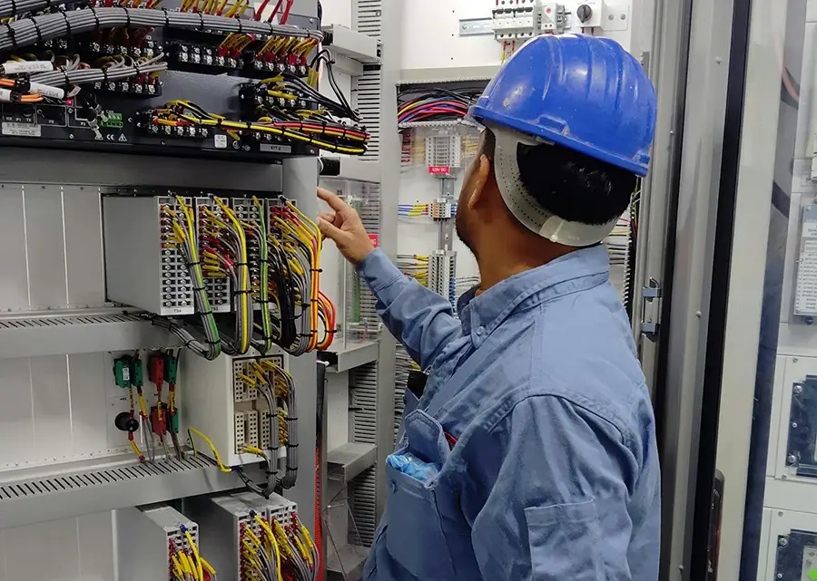 Man working on an electrical panel